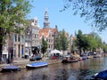 Amsterdam center - Oudezijds Voorburgwal - canal houses with tower Oude Kerk Royalty Free Stock Photo